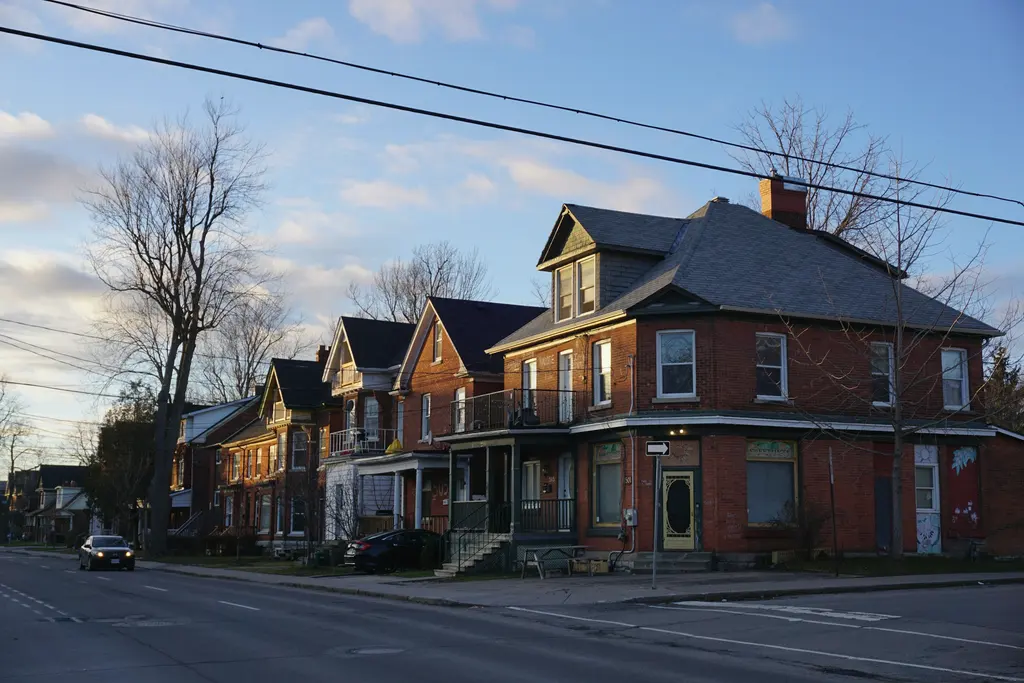 A row of brick houses on a residential street